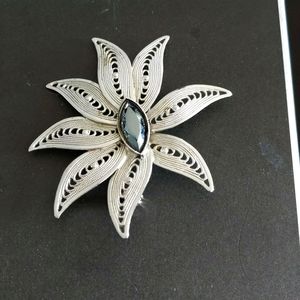 Vintage silver brooch with hematite center.